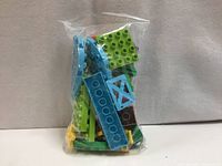 Front view of sealed bag showing assorted Duplo blocks