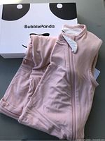 Sleep sack laid out next to branded box