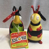 Front view of ladybug and bumblebee pouches with hang tag
