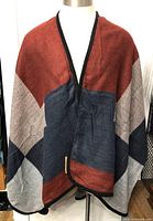 Front view of poncho scarf on mannequin