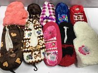 Ten pairs assorted slippers displayed together