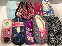 All ten assorted slippers displayed