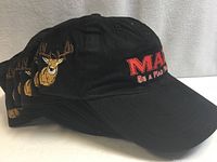 Stack of black caps showing deer embroidery and overall color