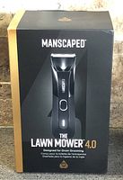 Front of retail box showing Manscaped Lawn Mower 4.0 branding