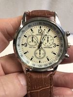 Front view showing dial details, brand, sub-dials, tachymeter