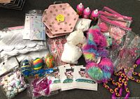 Overall view of all packaged party favor items laid out