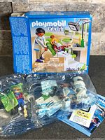 Front of Playmobil City Life Dentist set box with sealed inner bags visible