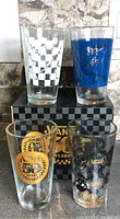 Four Vans 50th Anniversary glasses with box