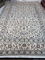 Full view of Kashan rug showing overall design and size