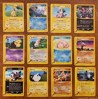 All 12 Aquapolis cards laid out 4×3 on tabletop