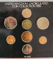 Front view of coins mounted in black card