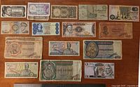 Fronts of all 17 banknotes arranged on tabletop