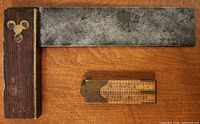 Ruler folded beside try square, showing brass details and patina