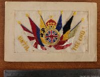 Front showing embroidered flags, motto and crowned Union Jack