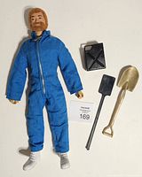 Front view of GI Joe figure with accessories laid beside