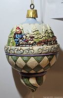 Side view focusing on raised Rudolph and sleigh scene with painted detail