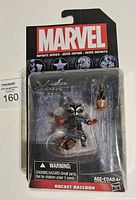 Front view of sealed Rocket Raccoon action figure in packaging