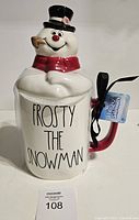 Front view of Rae Dunn Frosty The Snowman mug with lid