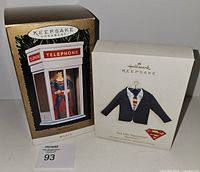 Both boxed Hallmark ornaments front view