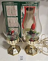 Both vintage Christmas hurricane lamps with cords and boxes
