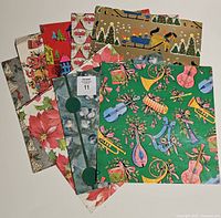 Stacked view of eight folded sheets showing various designs