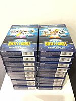 Stack of ten sealed Skylanders Battlecast boxes front left view