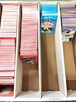 Three-divider card storage box with large quantity of red-border and blue-border Donruss baseball cards