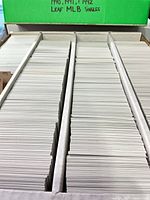 Open card storage box showing large quantity of cards organized in two rows