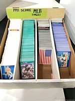 Long card storage box with four rows of 1991 Score MLB singles