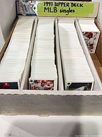 Three-row box filled with 1991 Upper Deck baseball singles