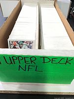 Front view of card storage box with handwritten Upper Deck NFL sign