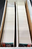 Two-row long cardboard storage box filled with 1992 Score baseball cards