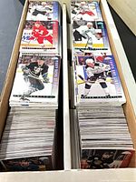 Long cardboard box filled with stacked hockey trading cards
