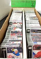 Two-row box filled with sleeved 2021-22 Upper Deck hockey cards