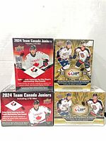 Front view of all four sealed booster boxes: two Team Canada Juniors (red) and two CHL (gold)