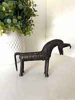 side view of bronze horse figurine