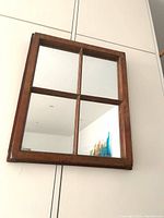 Front view showing 4-pane mirror in wood window frame