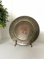 Front view showing peacock design and overall condition