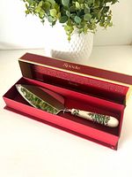 Cake server in open red Spode box showing stainless blade and porcelain handle