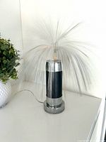 Full view of lamp with fiber optic plume and base