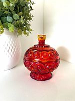 Full view of assembled amberina covered candy dish on pedestal base
