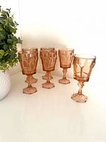 Six peach Fostoria Virginia goblets grouped