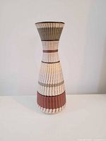 Full view of vase front showing color bands and shape