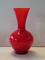 Full view of red cased glass vase front