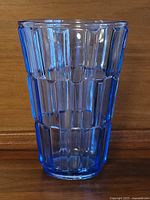 Full front view of cobalt blue pressed glass vase showing geometric panel design