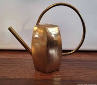Side view of brass mini watering can