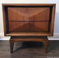 Front view showing diamond front drawers and leg structure