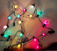 Lights powered on showing lit and unlit bulbs on bell frame