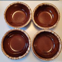Top view showing four identical brown drip bowls
