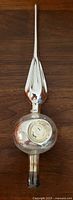Full view of silver glass finial tree topper